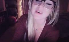 Horny blonde with glasses teases with her smoking hot breas