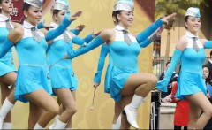 Hot young majorettes in blue flash their sexy legs as they